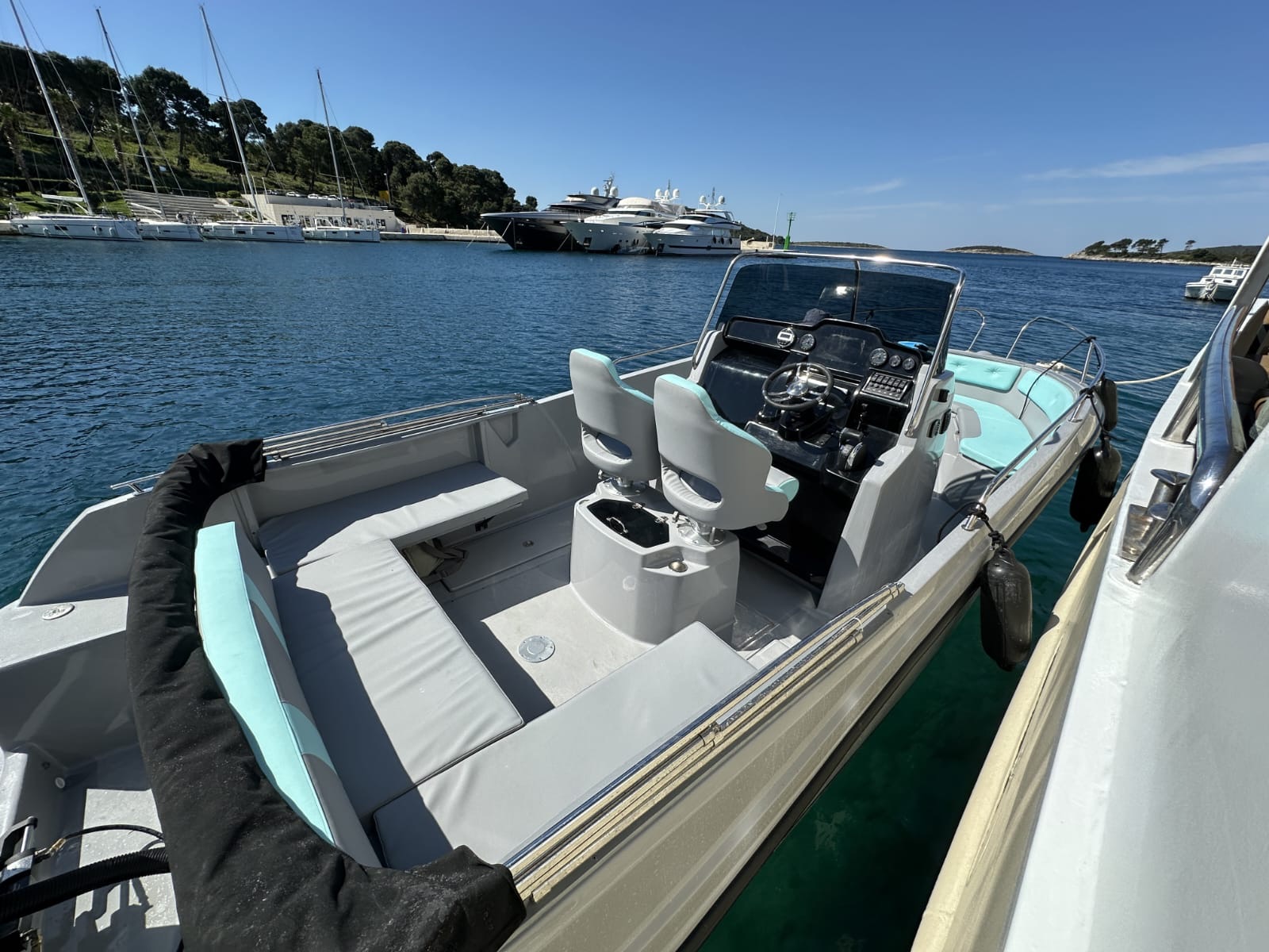 Comfortable private speedboat in an island marina