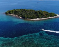 Krknjasi bay on the east coast of the island Veli Drvenik is known as the Blue Lagoon for its incredible hue of crystal clear water which create an unique tropical paradise.